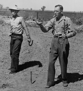 Photo of two men playing horseshoes
